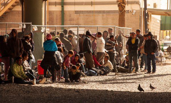 Migrants awaiting processing are confined behind temporary fencing under the Paso Del Norte Bridge on March 28, 2019 in El Paso, Texas. U.S. Christ Chavez/Getty Images
