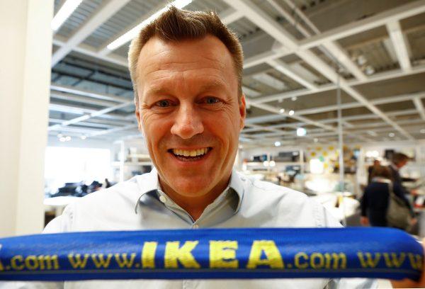 Jesper Brodin, chief executive of Ingka Group, which owns most stores of the world's biggest furniture group IKEA, poses with an IKEA bag at a store in Kaarst near Duesseldorf, Germany, on April 3, 2019. (Wolfgang Rattay/Reuters)