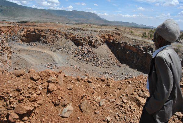 Peter Muchiri looks into an active quarry at Kanairobi village in Nakuru County, Kenya, on March 28, 2019. (Dominic Kirui for The Epoch Times)