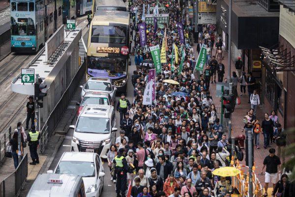 Protesters march along a street during a rally in Hong Kong on March 31, 2019 to protest against the government's plans to approve extraditions with mainland China, Taiwan and Macau. (Dale De La Rey/Getty Images)