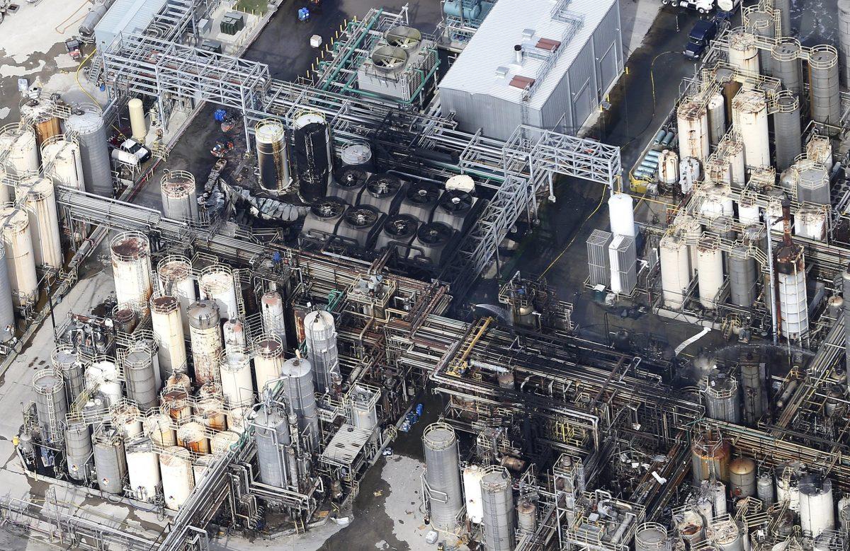 This aerial photo shows the KMCO chemical plant as firefighters spray water on a fire in Crosby, Texas on April 2, 2019. (Elizabeth Conley/Houston Chronicle via AP)