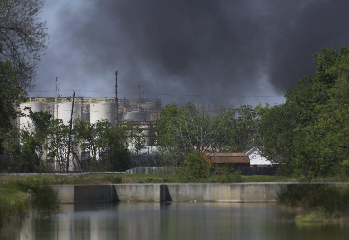 A plume of smoke rises over the site of a fire at the KMCO plant in Crosby, northeast of Houston, Texas, on April 2, 2019. (Godofredo A. Vasquez/Houston Chronicle via AP)