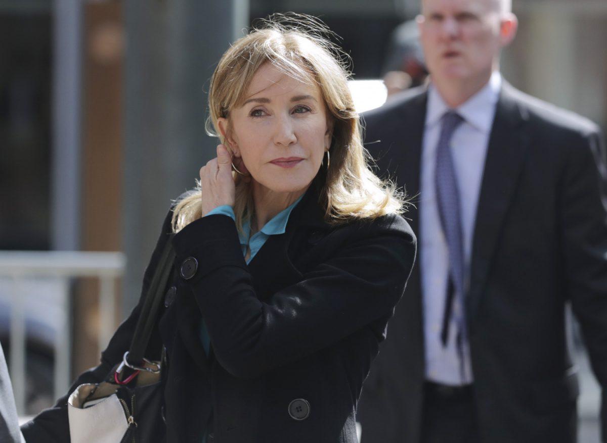 Actress Felicity Huffman arrives at federal court in Boston to face charges in a nationwide college admissions bribery scandal on April 3, 2019. (Charles Krupa/AP Photo)