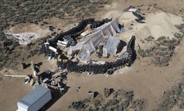 A ramshackle compound in the desert area of Amalia, N.M., on Aug. 10, 2018. (Brian Skoloff/File via AP)