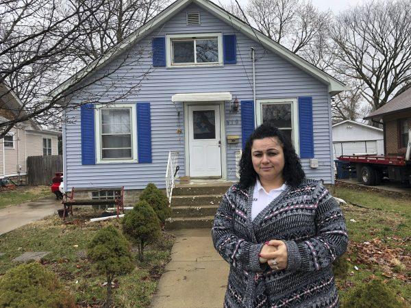Linda Ramirez stands in front of her house in Aurora, Ill., on April 4, 2019. (Carrie Antlfinger/Photo via AP)