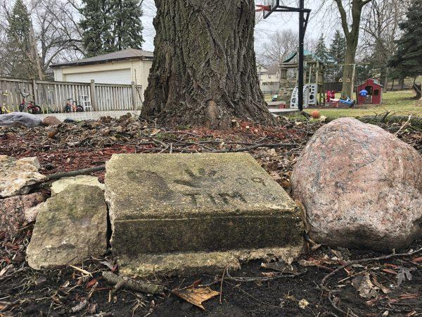 A slab of concrete sits in the backyard of the house where Timmothy Pitzen used to live in Aurora, Ill., picture taken in April, 2019. (Carrie Antlfinger/Photo via AP)