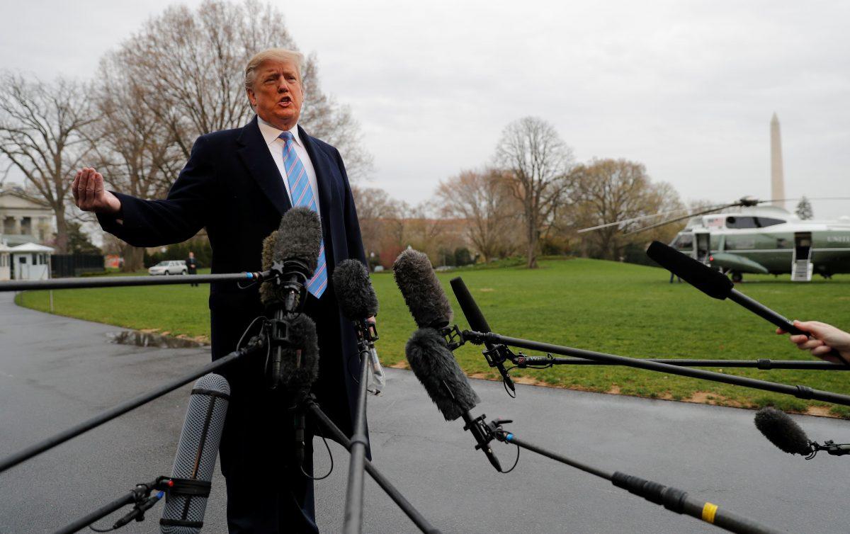 President Donald Trump talks to reporters as he departs for travel to the U.S.-Mexico border from the White House on April 5, 2019. (Reuters/Carlos Barria)