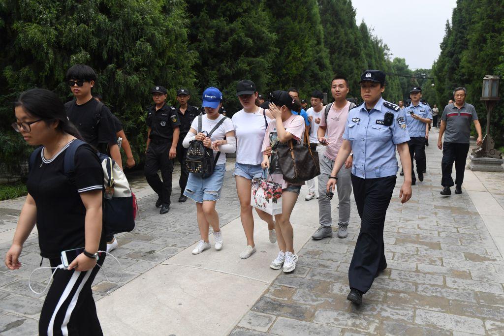 Hundreds of police swarmed the streets of Beijing's financial district on Aug. 6, 2018 as Chinese authorities aggressively quashed a planned protest against losses sustained by peer-to-peer (P2P) lending platforms. (Greg Baker/AFP/Getty Images)