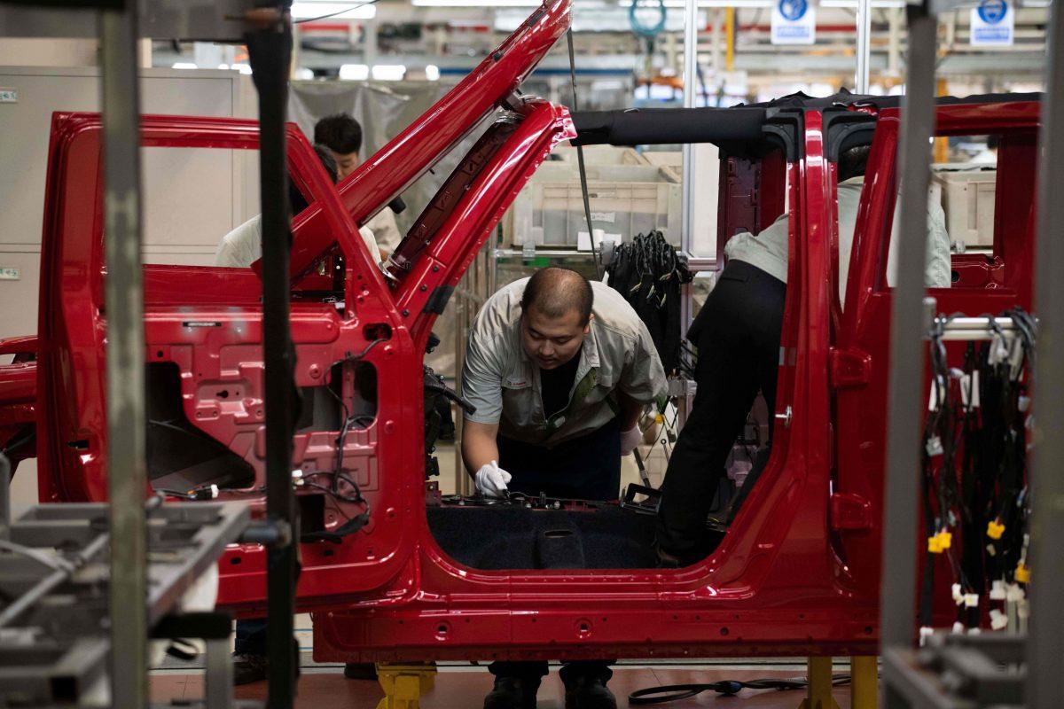 Workers on an SUV production line in Beijing on Aug. 29, 2018. President Donald Trump began imposing a series of tariffs on China beginning in January 2018. (Nicolas Asfouri/AFP/Getty Images)