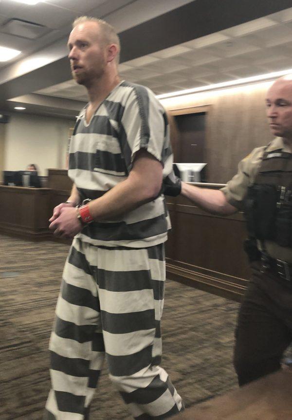 Chad Isaak, left, appears in court in Mandan, North Dakota ,on April 5, 2019. (James MacPherson/AP Photo)