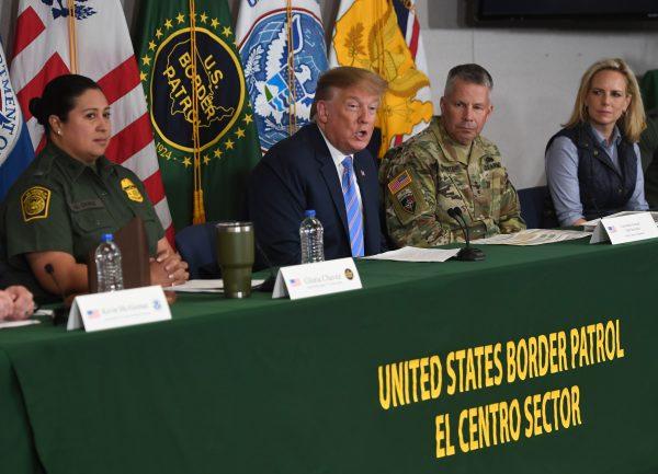 President Donald Trump (C) and Secretary of Homeland Security Kirstjen Nielsen (R) during a roundtable on immigration and border security at the Border Patrol Calexico Station in Calexico, Calif., on April 5, 2019. (Saul Loeb/AFP/Getty Images)