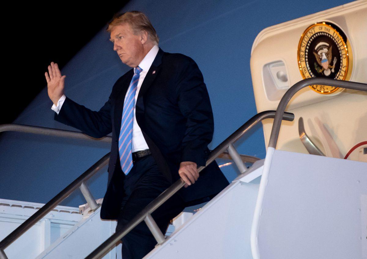 President Donald Trump waves as he disembarks from Air Force One upon arrival at McCarran International Airport in Las Vegas, Nev., late on April 5, 2019. (Saul Loeb/AFP/Getty Images)