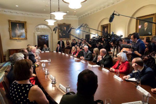 President Donald Trump with Rep. Kevin McCarthy (R-Calif., center), other elected officials, and law enforcement officials at a roundtable in California on May 18, 2018. (White House)