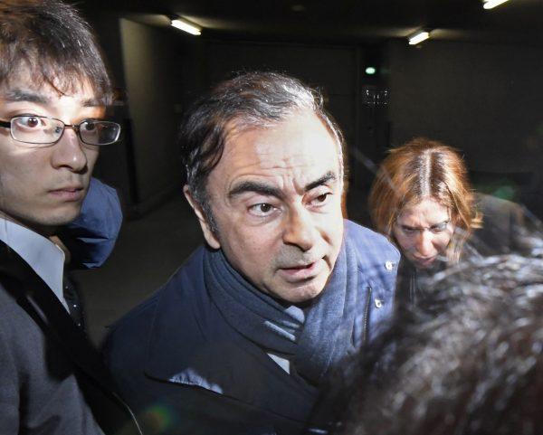 Former Nissan Chairman Carlos Ghosn, center, leaves his lawyer's office in Tokyo, Japan on April 3, 2019. (Sadayuki Goto/Kyodo News via AP, File)