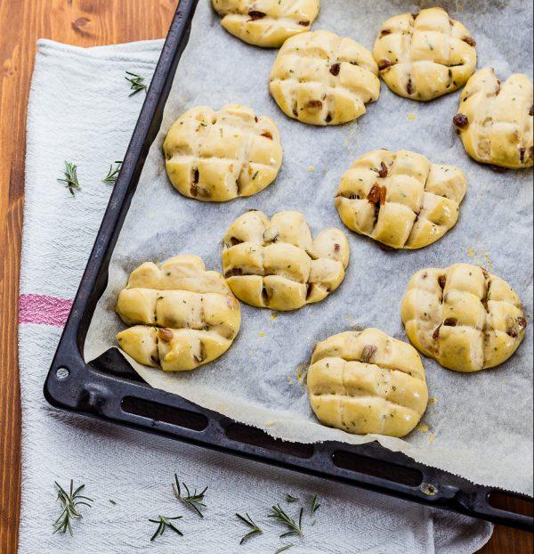 Following tradition, the soft buns are scored with a cross before baking. (Giulia Scarpaleggia)