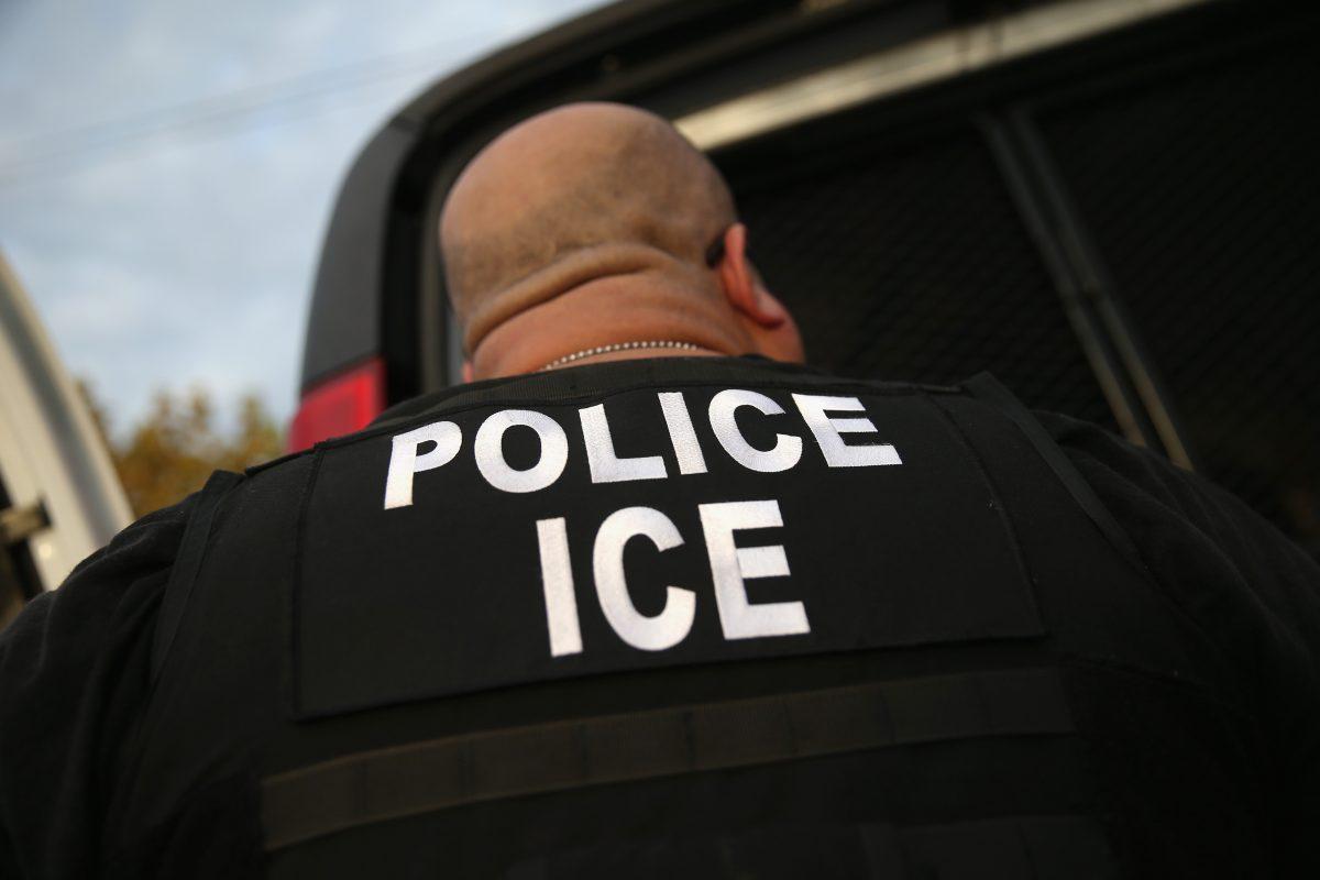 An Immigration and Customs Enforcement agent detains an illegal immigrant in a file photograph. (John Moore/Getty Images)