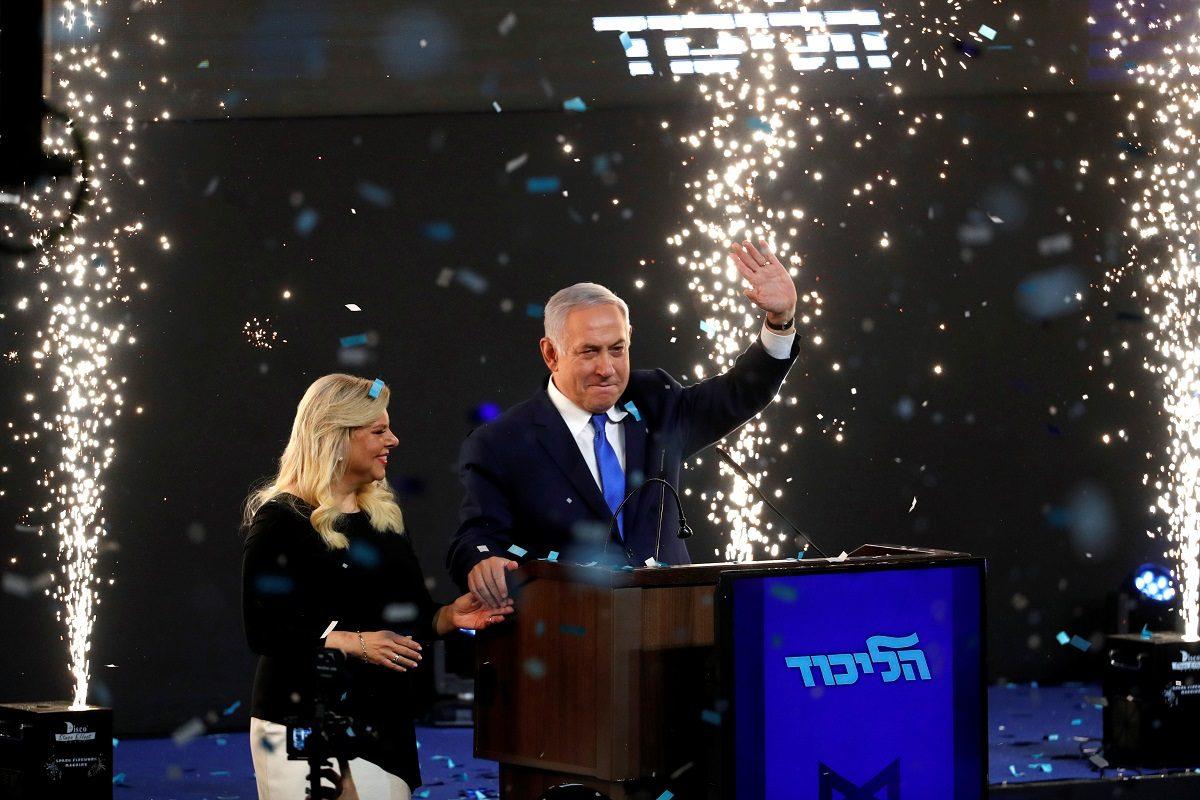 Confetti falls as Israeli Prime Minister Benjamin Netanyahu and his wife Sara stand on stage after Netanyahu spoke following the announcement of exit polls in Israel's parliamentary election at the party headquarters in Tel Aviv, Israel on April 10, 2019. (Ronen Zvulun/Reuters)