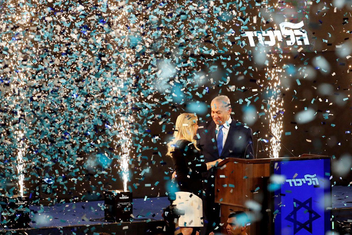 Confetti falls as Israeli Prime Minister Benjamin Netanyahu and his wife Sara stand on stage after Netanyahu spoke following the announcement of exit polls in Israel's parliamentary election at the party headquarters in Tel Aviv, Israel on April 10, 2019. (Ronen Zvulun/Reuters)