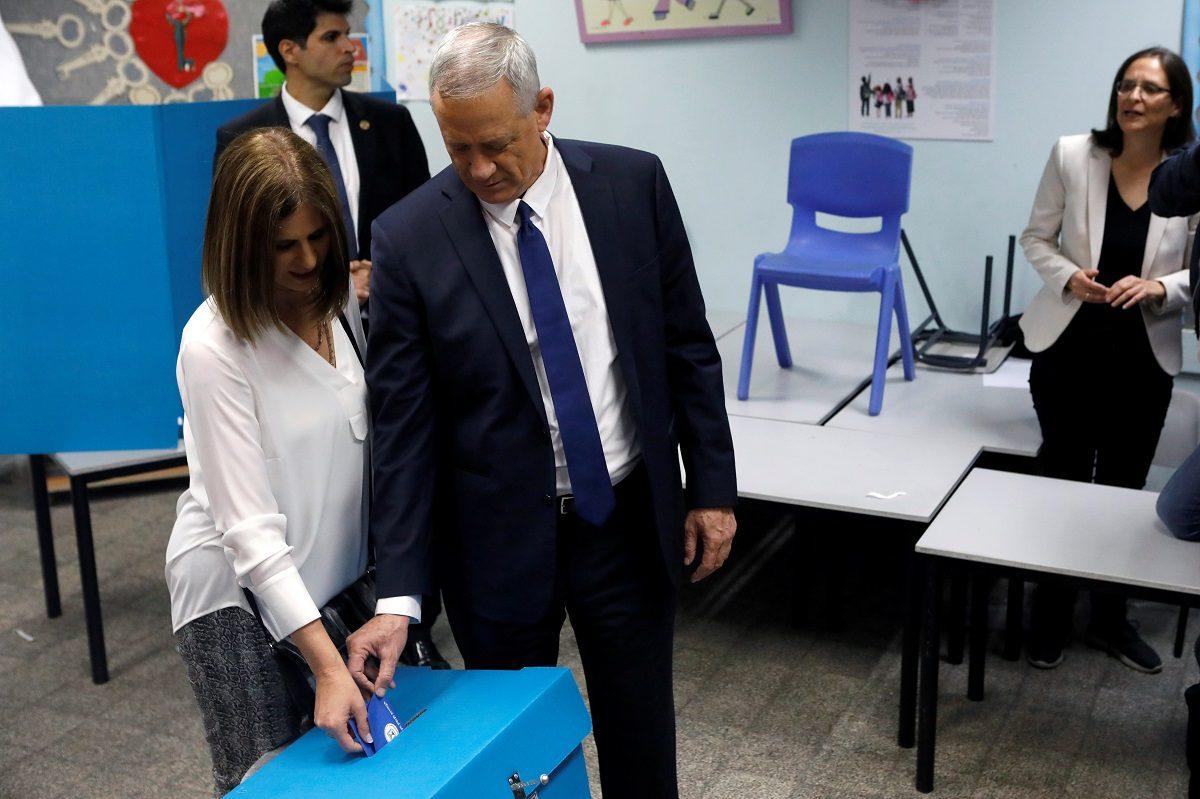 Benny Gantz, leader of Blue and White party, and his wife Revital cast their ballots as Israelis began voting in a parliamentary election, at a polling station in Rosh Ha'ayin, Israel on April 9, 2019. (Nir Elias/Reuters)