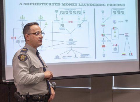 RCMP Sgt. Francois-Olivier Myette explains the dismantling of an international money-laundering network on Feb. 12, 2019, in Montreal. (The Canadian Press/Ryan Remiorz)