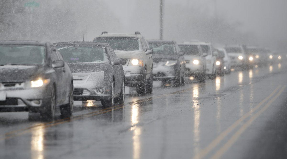 Traffic backs up along 56th Avenue as a spring storm rolls in before the evening rush hour in Denver, on April 10, 2019. (David Zalubowski/AP Photo)