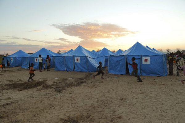 Women and children are outside a displacement camp in Beira, Mozambique on March, 31, 2019. (Tsvangirayi Mukwazhi/Photo via AP)