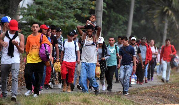 Honduran migrants leave the Metropolitan Center of San Pedro Sula, 300 kilometers north of Tegucigalpa, to travel to the Guatemala border on April 10, 2019. (Orlando Sierra/AFP/Getty Images)