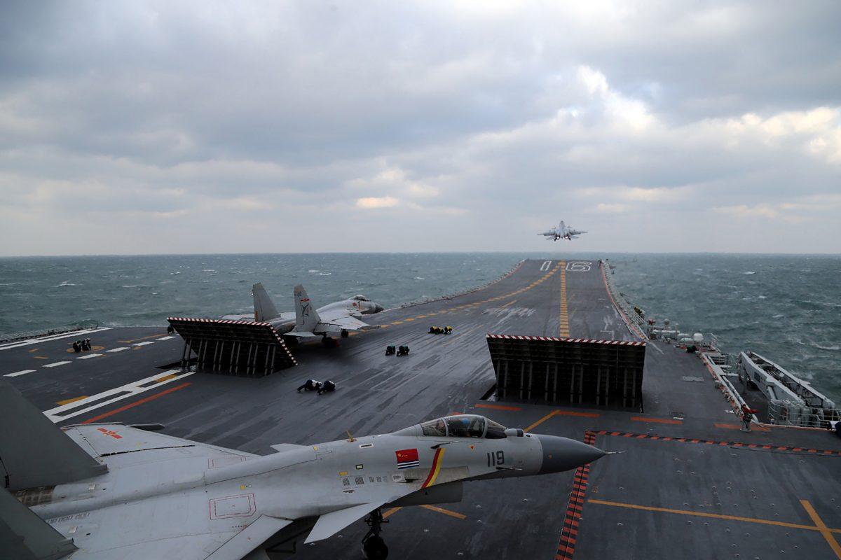 Chinese J-15 fighter jets being launched from the deck of the Liaoning aircraft carrier during military drills in the Yellow Sea, off China's east coast, on Dec. 23, 2016. (STR/AFP/Getty Images)
