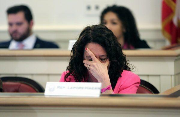 Ohio Representative Michele Lepore-Hagan wipes tears from her face during a hearing to propose amendments to the "Heartbeat Bill" which was later voted to pass through the committee and to the House floor at the Ohio Statehouse in Columbus, Ohio on April 9, 2019. (Brooke LaValley/Columbus Dispatch via AP)