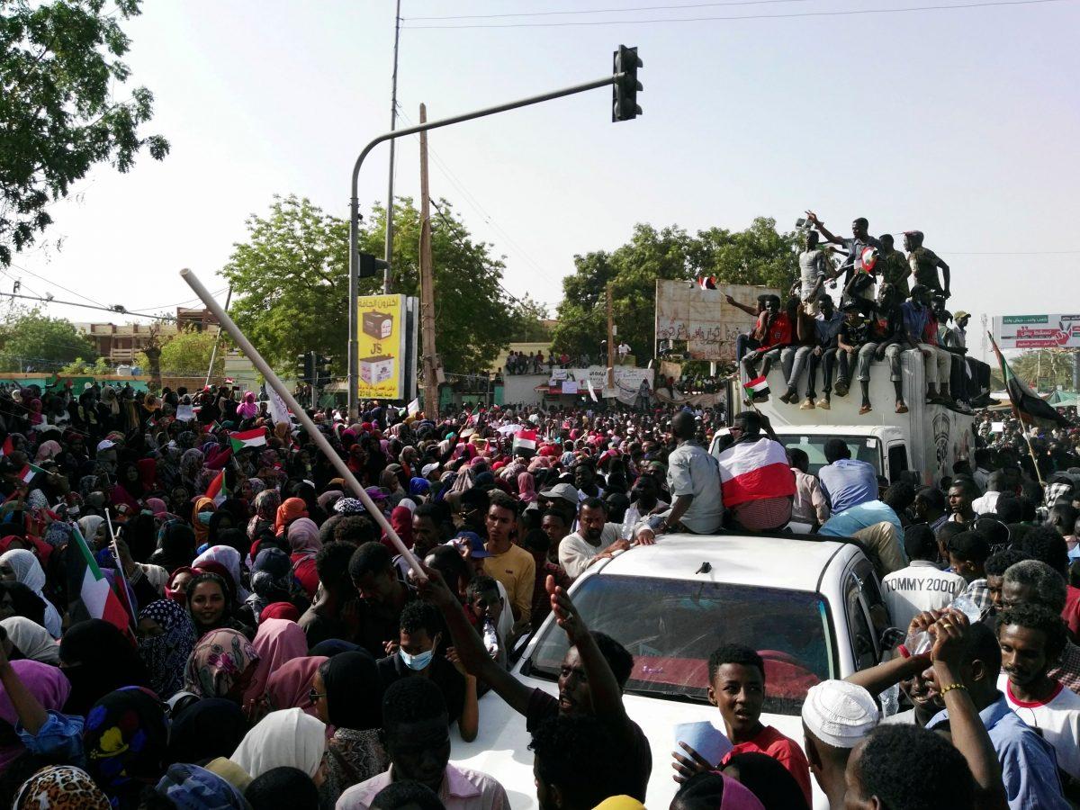 Sudanese demonstrators gather in a street in central Khartoum on April 11, 2019, after one of Africa's longest-serving presidents was toppled by the army. (AFP/Getty Images)