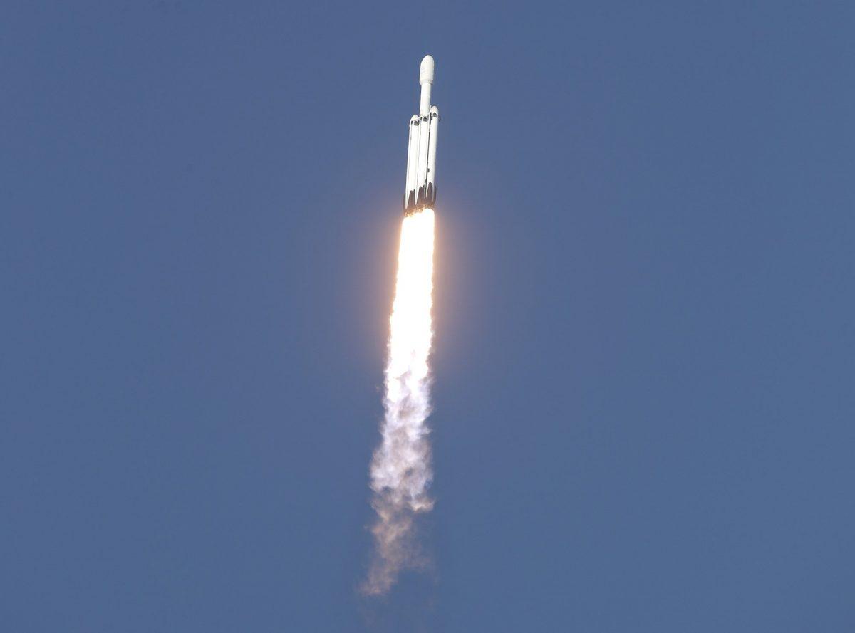 A SpaceX Falcon Heavy rocket carrying a communication satellite lifts off from pad 39A at the Kennedy Space Center in Cape Canaveral, Fla., Thursday, April 11, 2019. (John Raoux/AP Photo)