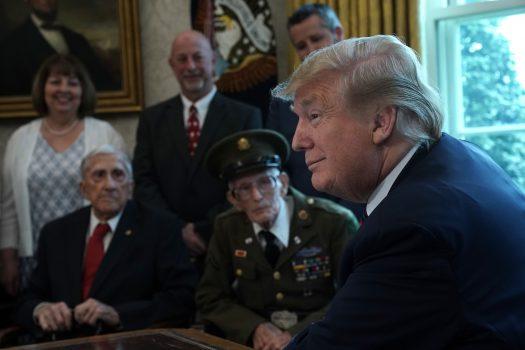 President Donald Trump meets with World War II veterans in the Oval Office of the White House in Washington on April 11, 2019. (Alex Wong/Getty Images)