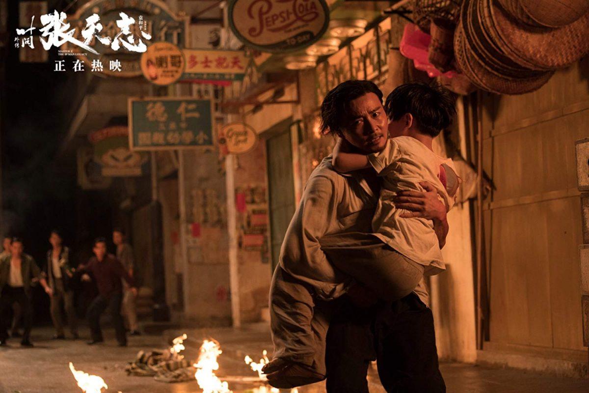 Cheung Tin-chi (Zhang Jin, L) carries son Fung (Henry Zhang) in "Master Z: Ip Man Legacy." (Well Go USA Entertainment)