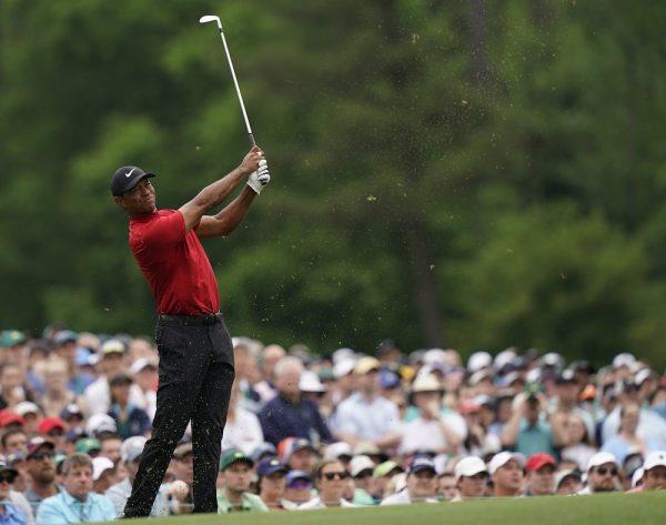 Tiger Woods hits on the 12th hole during the final round for the Masters golf tournament in Augusta, Ga., on April 14, 2019. (David J. Phillip/AP Photo)