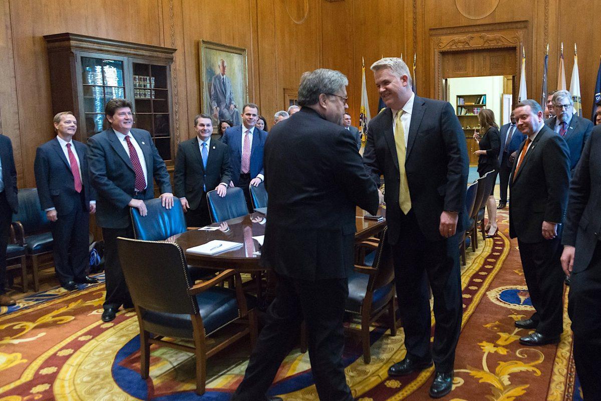 Attorney General William Barr shakes hands with U.S. Attorney John Huber at the Justice Department in Washington in March 2019. (Courtesy Justice Department)