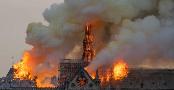 Smoke billows as flames burn through the roof of the Notre Dame de Paris Cathedral on April 15, 2019, in the French capital Paris. (Fabien Barrau/AFP/Getty Images)