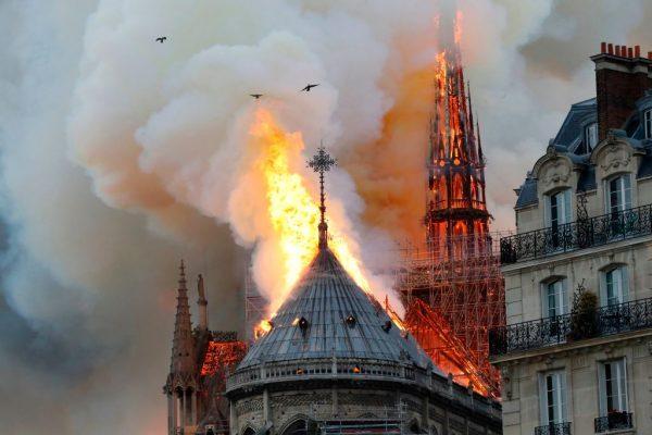 Smoke and flames rise during a fire at the landmark Notre Dame cathedral in central Paris on April 15, 2019, potentially involving renovation work being carried out at the site, the fire service said. (Francois Guillot / AFP/Getty Images)