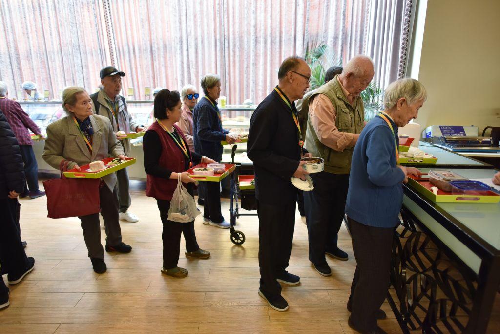 Residents line up for lunch at the Yanyuan community center for senior citizens, on the outskirts of Beijing, on Dec. 5, 2018. (Greg Baker/AFP/Getty Images)