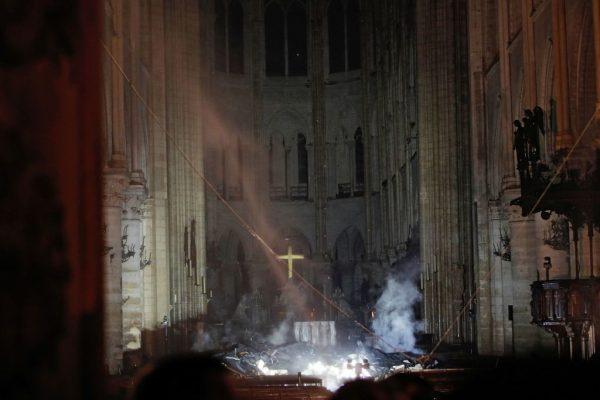 Smoke rises in front of the altar cross at Notre-Dame Cathedral in Paris, France, on April 15, 2019 (Philippe Wojazer/AFP/Getty Images)