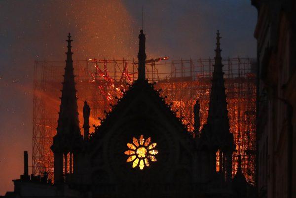 Flames and smoke rise from Notre Dame cathedral as it burns in Paris, on April 15, 2019. (Thibault Camus/AP Photo)