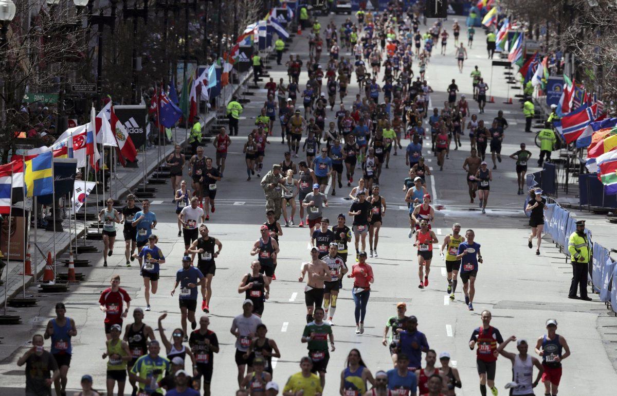 Runners race to the finish line in the 123rd Boston Marathon in Boston on April 15, 2019. (Charles Krupa/AP Photo)