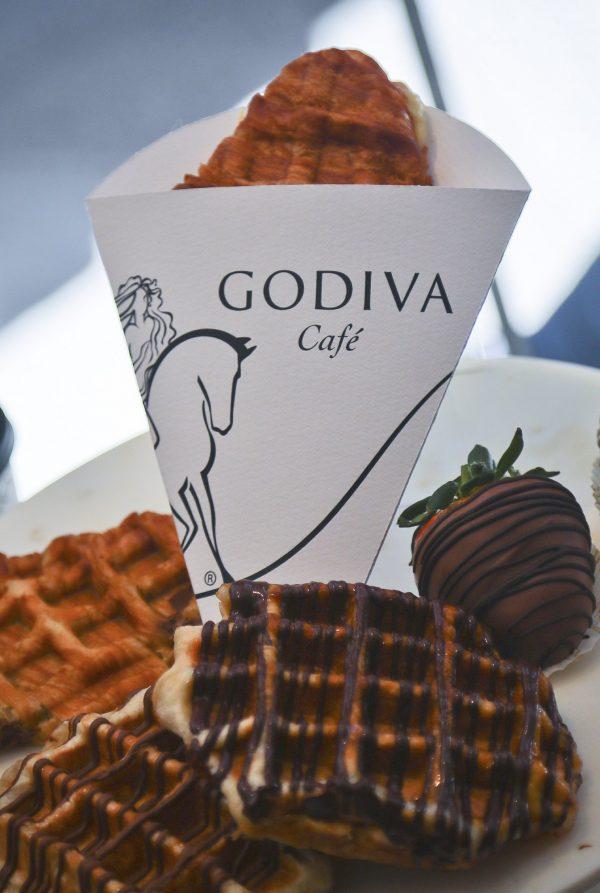 This photo shows new pastry and hybrid meals on display along with traditional chocolate covered strawberry at Godiva's new cafe in N.Y., on April 16, 2019. (Bebeto Matthews/AP)