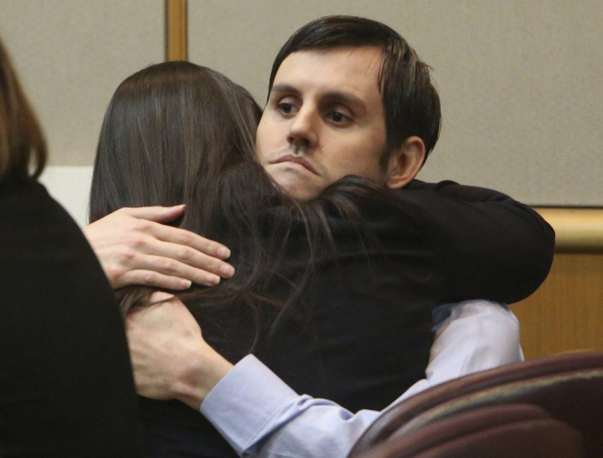 Defendant John Jonchuck hugs his attorney Jessica Manuele after a jury found him guilty, Tuesday, April 16, 2019. (Scott Keeler/Tampa Bay Times/AP)