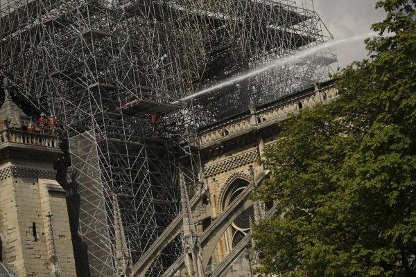 Firefighters work with a hose at the Notre Dame cathedral in Paris, on April 17, 2019. (Francisco Seco/AP Photo)