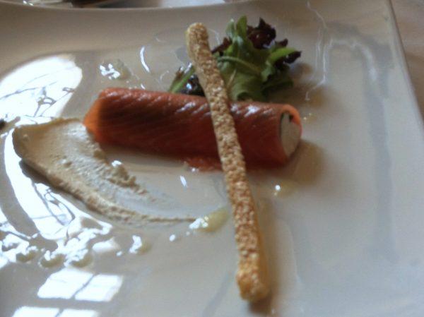 Appetizer of smoked salmon with creamy horseradish emulsion and a sesame seed breadstick.(John M. Smith)