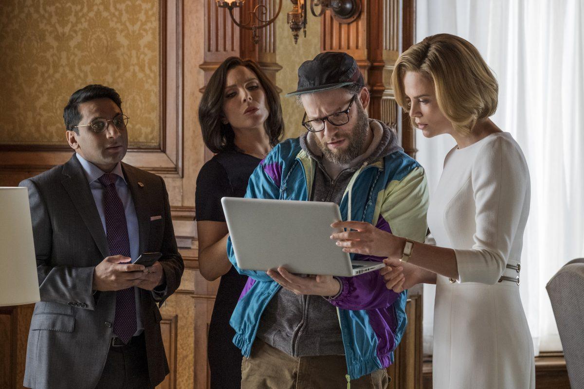 (L–R) Tom (Ravi Patel), Maggie (June Diane Raphael), Fred Flarsky (Seth Rogen), and Charlotte Fields (Charlize Theron) in “Long Shot.” (Philippe Bossé/Lionsgate)