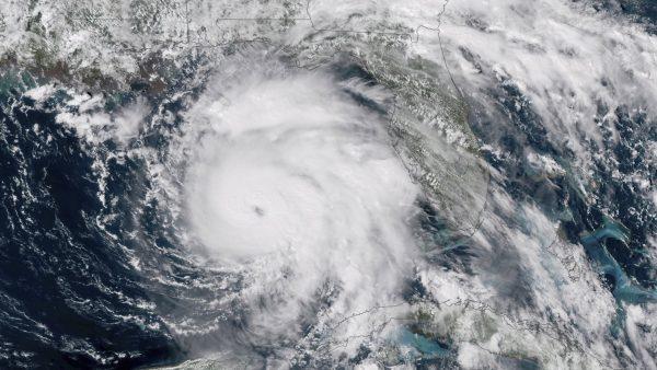 This satellite image provided by NOAA shows Hurricane Michael, center, in the Gulf of Mexico on Oct. 9, 2018. Weather forecasters have posthumously upgraded last fall's Hurricane Michael from a Category 4 storm to a Category 5. (NOAA via AP)