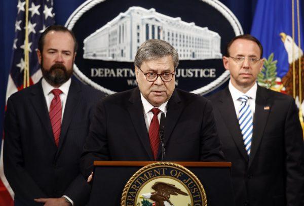 Attorney General William Barr speaks alongside Deputy Attorney General Rod Rosenstein (R) and acting Principal Associate Deputy Attorney General Edward O'Callaghan (L) at the Department of Justice in Washington, on April 18, 2019. (Patrick Semansky/AP Photo)