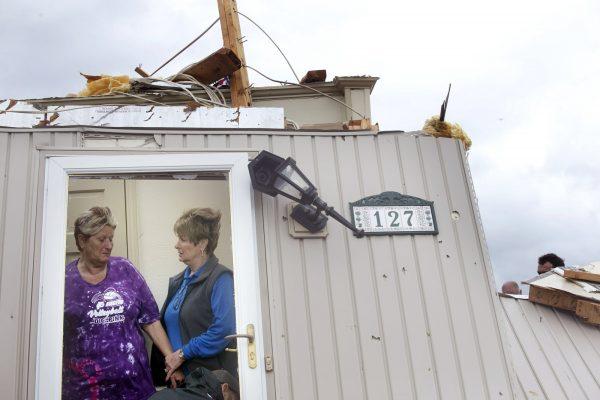 Delores Anderson, left, is comforted by good friend Bea Meeks of Rocky Mount, after her home was destroyed by a tornado in Franklin County, Va., on April 19, 2019. (Heather Rousseau/The Roanoke Times via AP)