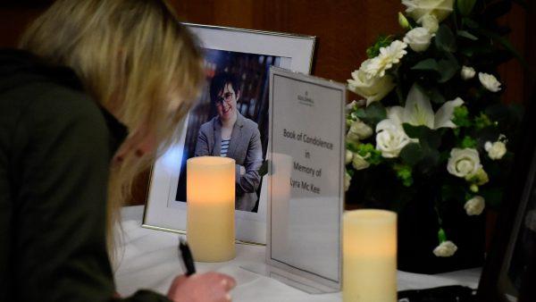 A woman signs a book of condolences in the Guildhall for 29-year-old journalist Lyra McKee who was shot dead in Londonderry, Northern Ireland on April 20, 2019. (Clodagh Kilcoyne/Reuters)